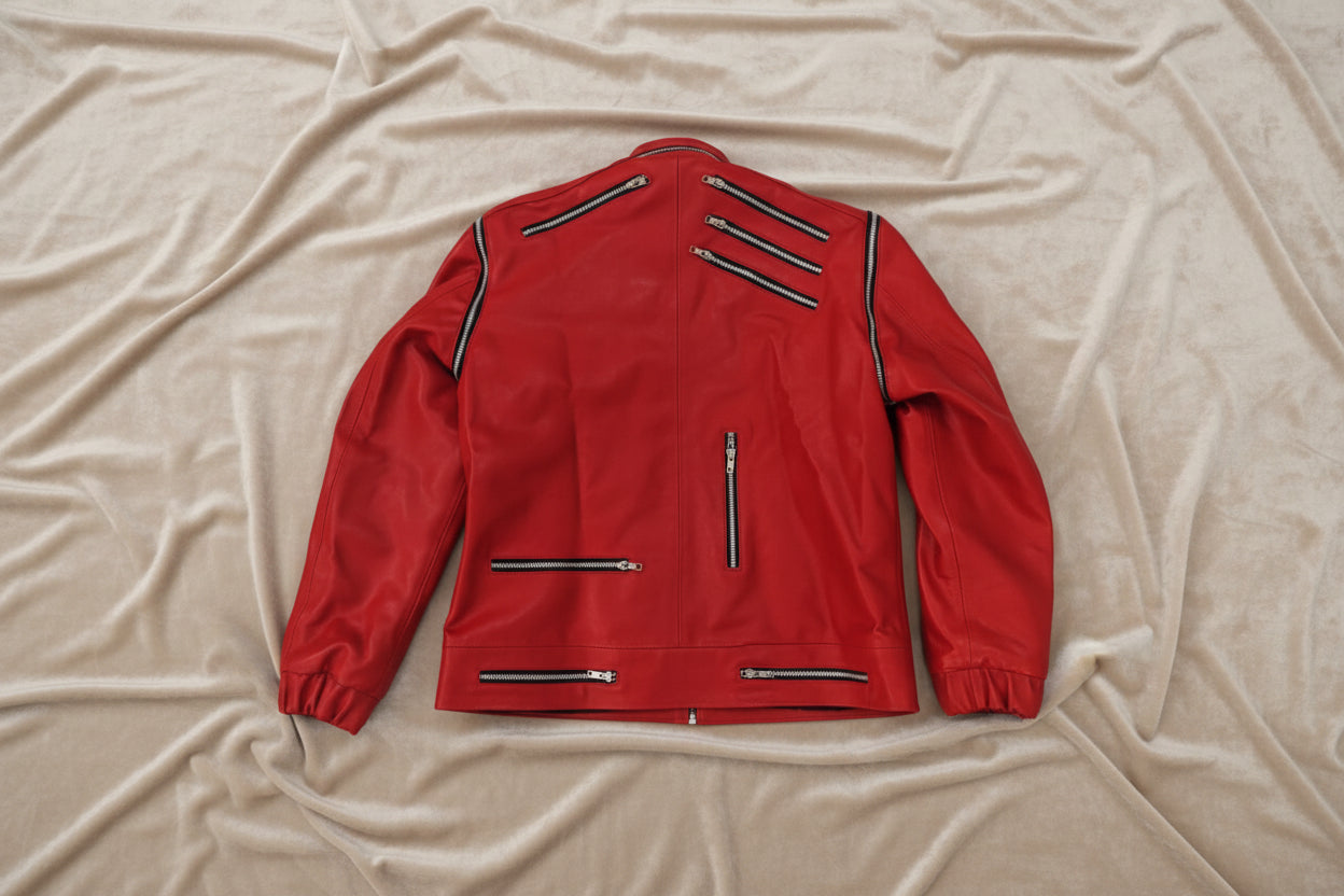 Red michael jackson beat it jacket back, paced on a light beige velour fabric