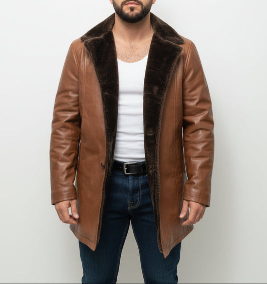 Man wearing a brown leather coat with fur lining against a plain background