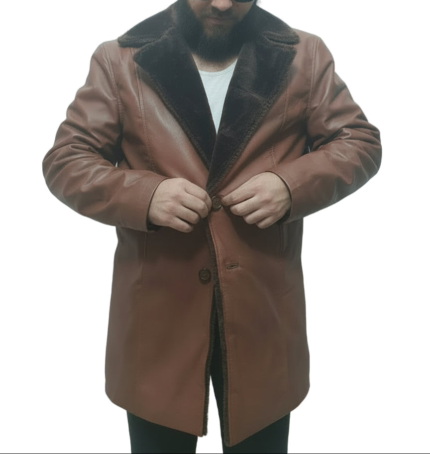 Man wearing a brown coat with a fur collar against a white background