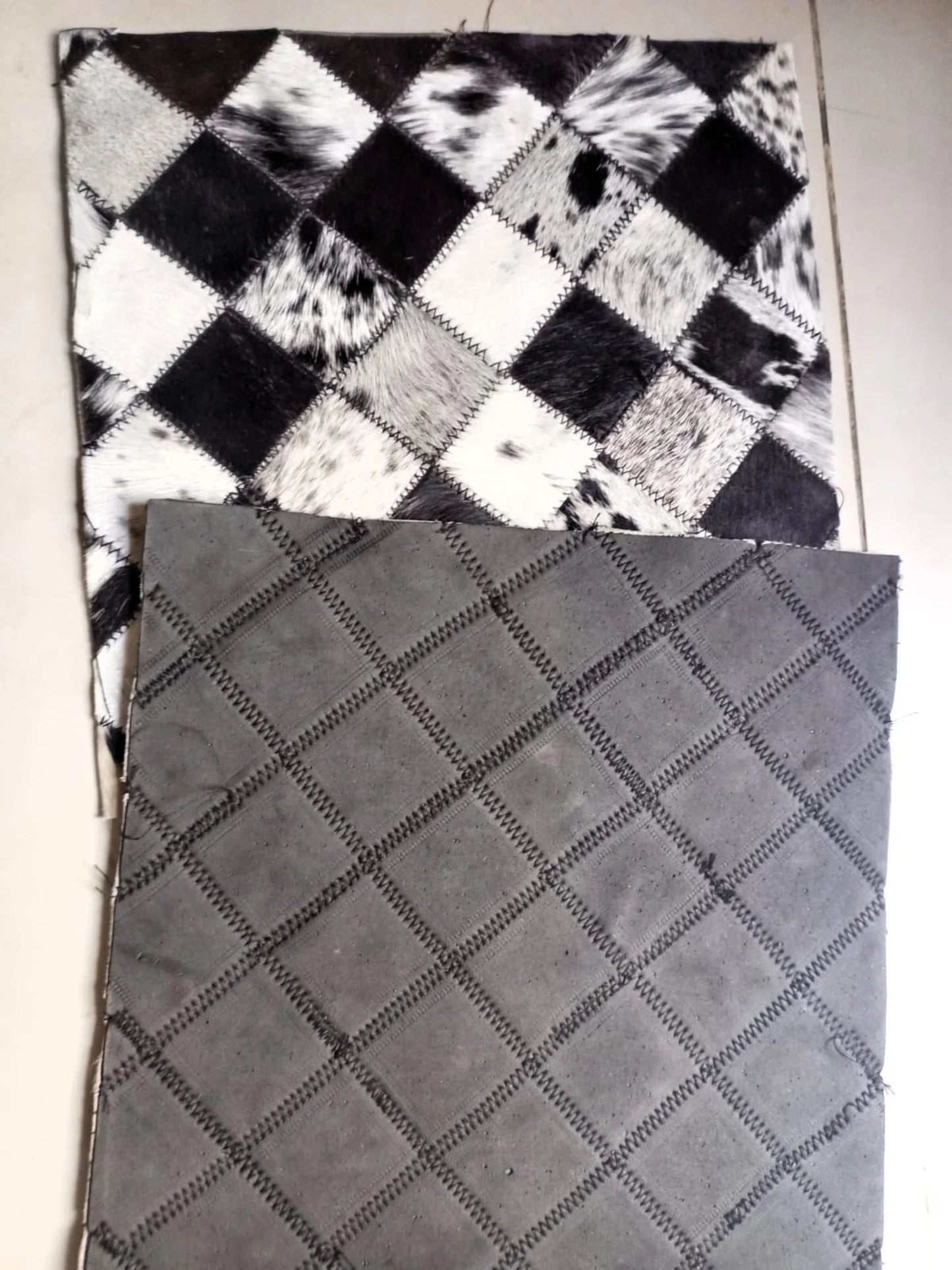 Two textured fabric samples, one checkered and one diamond-patterned, on a white background.