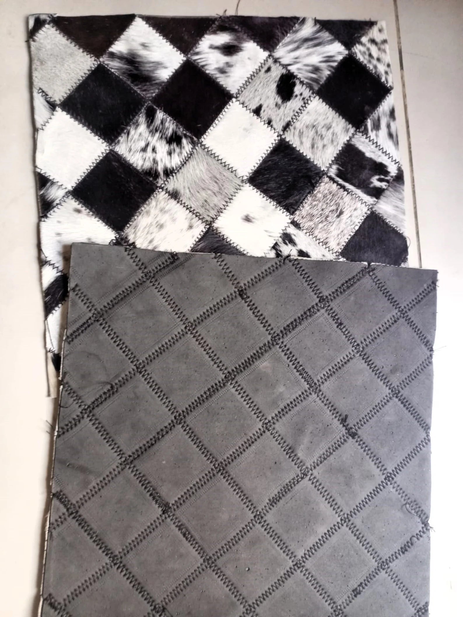 Two textured fabric samples, one checkered and one diamond-patterned, on a white background.