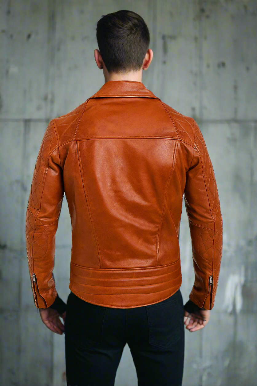 Man wearing an orange motorcyle leather jacket on a grey background