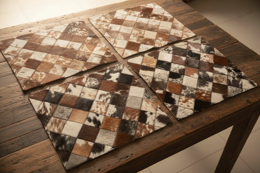 Four patchwork-style rugs with different patterns on a tiled floor.